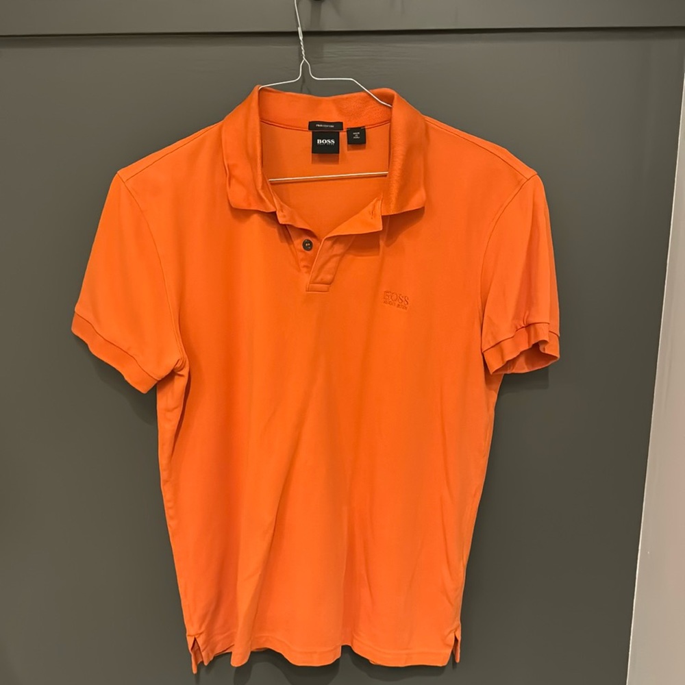 Orange Hugo Boss polo shirt in size Large slightly used